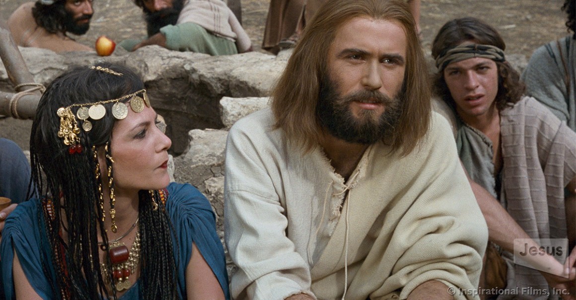 Jesus talking to an outcast woman kindly