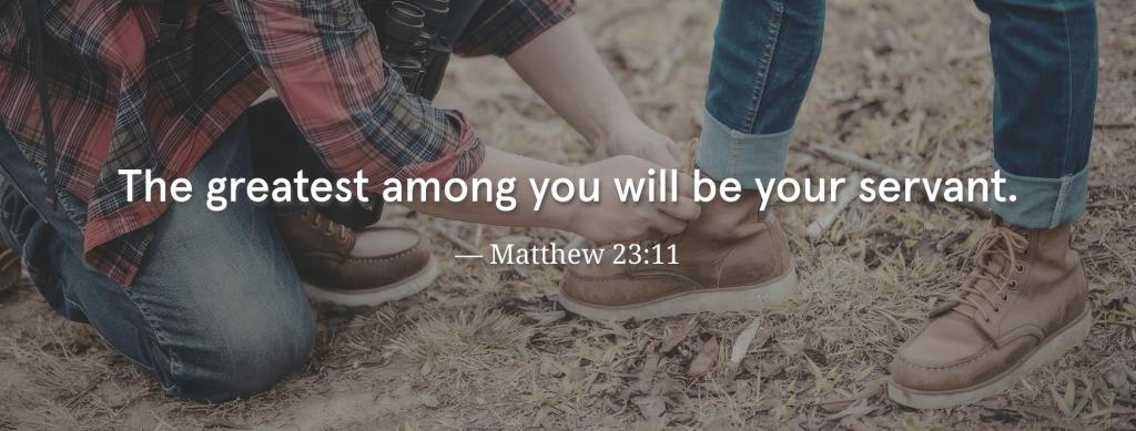 Matthew 23:11 overlaid on an image of someone tying another man's shoe. This is a Bible verse on service to God. 