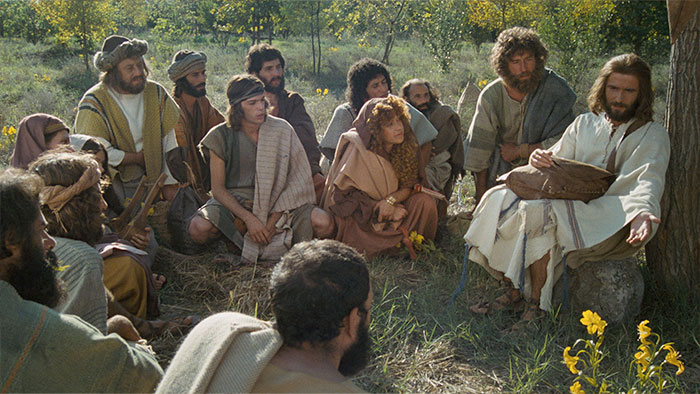 Jesus sitting and teaching his disciples