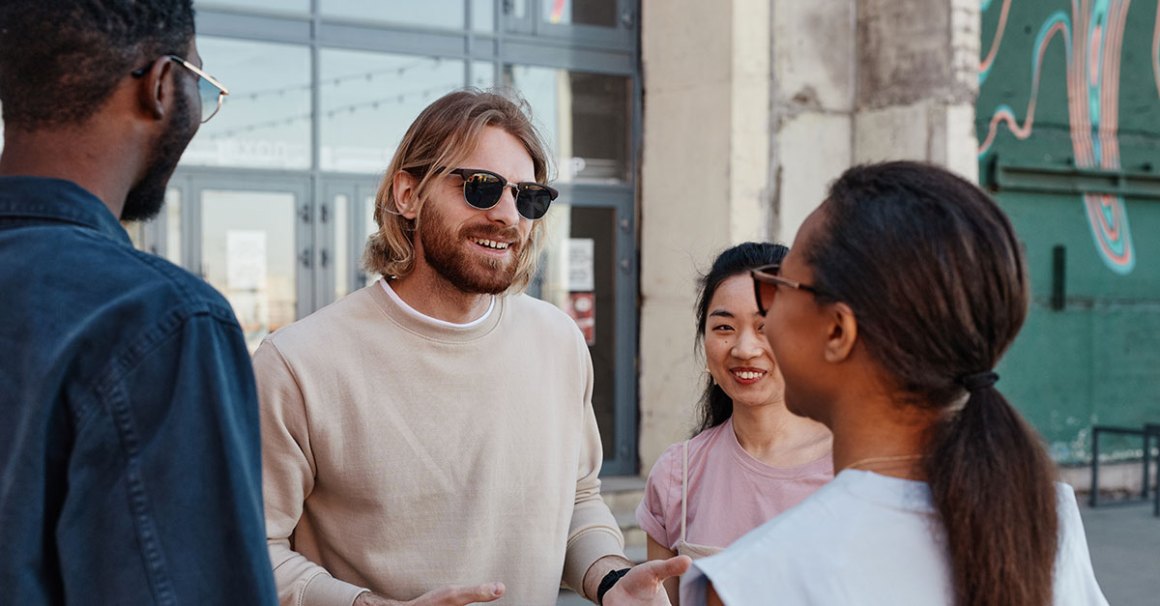 Person speaking to group outside