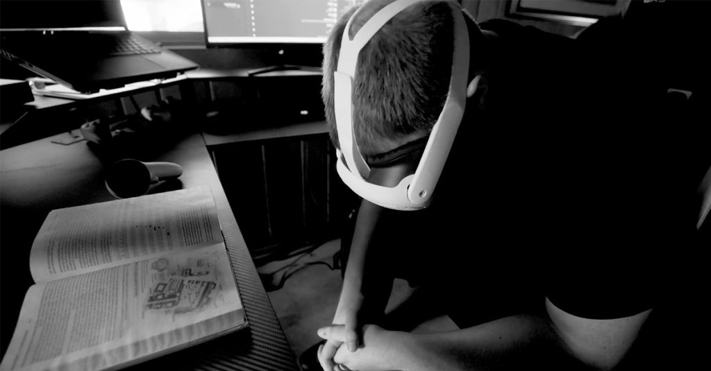 Man with headset on praying